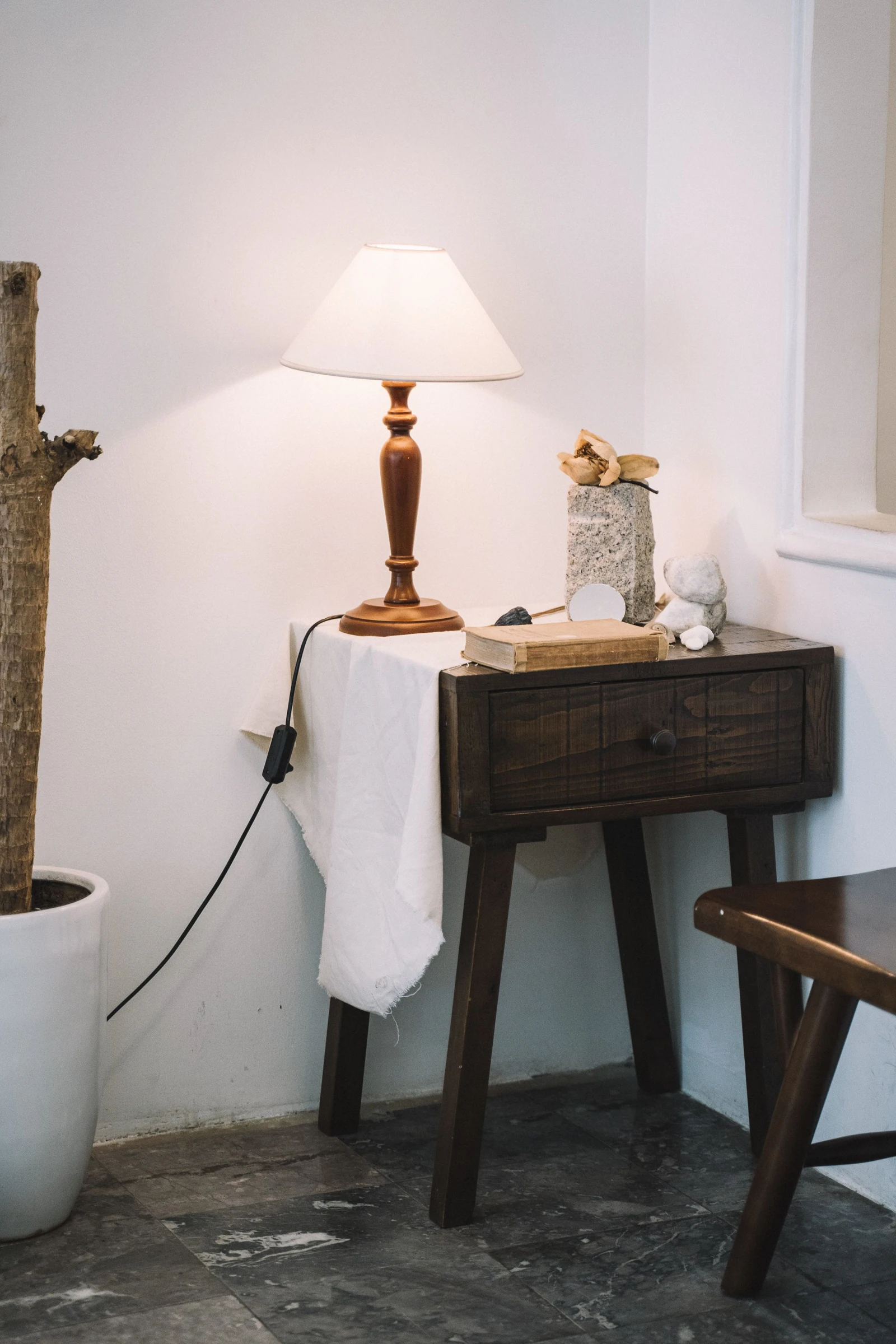 A wooden table with a lamp. Placement context only; this is not the IKEA LACK.