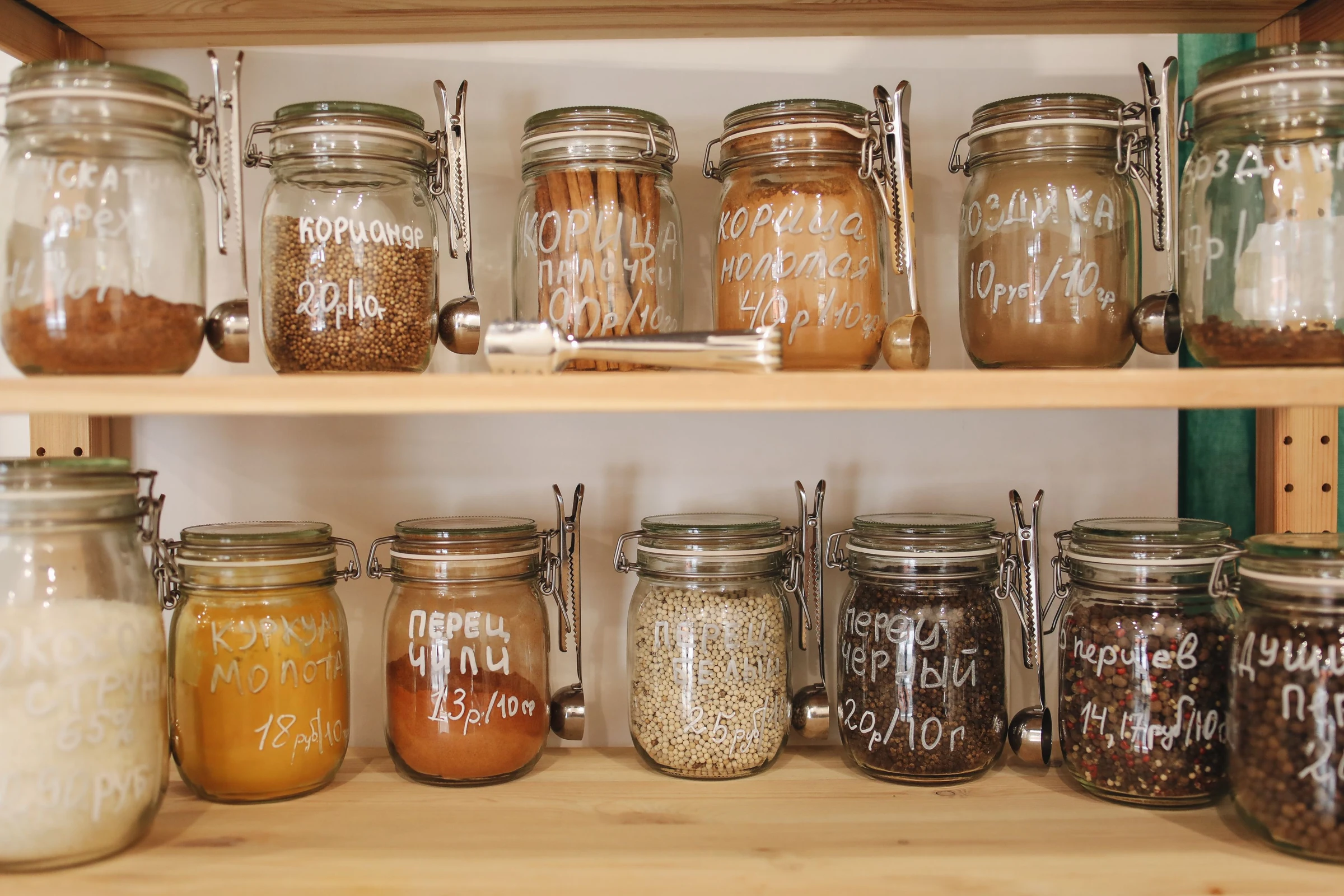 Pantry jars on fixed shelves. Organization context only; not a RÅSKOG product photo.